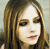 Three pixelated images of a person with long light brown hair appear above four text variations reading 'AVRIL LAVIGNE' in pink, red, blue, and green.