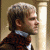 nine shows a man in profile with changing text beneath him, set against