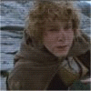 A person with curly light brown hair in a brown cloak holds another person while text appears on screen.