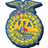 A pixelated circular emblem with yellow and blue tones, featuring a smiling face design on the left side of a four-quadrant