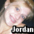 Pixelated close-up of a person with light hair and blue eyes, mouth open in a smile, overlaid with bold white text reading 'Jordan' on black background.