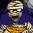 Animated pixel art of a mummy with bandages, orange sash, and blue-and-yellow object on head against dark background.