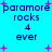 Pixelated text and pink plus signs on a bright cyan background with repeated 'paramore rocks 4 ever' phrases.