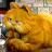 A 48x48 pixel animated buddy icon featuring Garfield the cat in two frames: a close-up of his face on the left and promotional text with his headshot on the right, both rendered in low-resolution pixel art style.