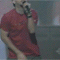 A person in a red shirt sings into a microphone across showing varied hand and head positions