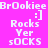 Pixelated text displays 'BrOokiee :] Rocks Yer sOCKS' on four distinct background colors: bright pink, dark purple, black, and medium purple.