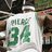 A pixelated image shows a person wearing a white jersey with green text and numbers, next to a green background with black text reading "I <3 Paul Pierce".