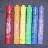 A 48x48 pixel animated buddy icon featuring a contact sheet layout with two rows of rainbow-colored markers on the left and text on the right, displayed in a gray background context.