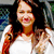 A woman with long dark hair wearing a white top and red-brown jacket smiles while making a peace sign, displayed in three views of the same asset.
