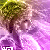 Pixelated image of a figure with dark hair and purple clothing against a gradient background transitioning from green to pink.