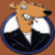 A 50x50 pixel animated buddy icon featuring a cartoon dog in a suit on the left and green text "Original Icons .com" on a dark green background on the right, displayed as a contact sheet with two frames.