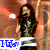Animated icon shows two figures with text labels; left figure has long dark hair and green top, right figure has curly dark hair and blue shirt. Text "IGay" in blue on left, "Harra h" in pink on right.