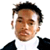 Static pixelated icon of a person with short dark hair wearing a white shirt and black jacket against a plain background.