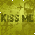 Static image with repeated text "KISS ME" on a yellow-green patterned background featuring small decorative shapes.