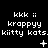 Pixel art animation of repeating text and symbols on black background with three of 'kkk ii', 'krappy' variations, and 'kiitty kats.'