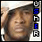 A pixelated image of a person with dark hair wearing a white cap, with vertical text reading 'USER' on the right side.