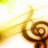 A pixelated image shows a golden spiral with a glowing yellow light source on the left side, set against a white background.