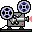Two pixel-art film projectors on a white background, each with rotating reels and red indicator lights.