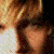 A 4-frame contact sheet of a young man with blonde hair in various poses against blue and white backgrounds, displayed as an animated icon preview.