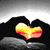 Animated heart-shaped icon with gradient colors transitioning from yellow to red, set against a dark background with light gray accents.