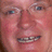 Pixelated portrait of a person with glasses and braces, blue text reading 'MR.KEATING IS MY IDOL' on light background.