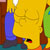 Pixelated yellow background with blue and green shapes, brown vertical elements on left and right edges, small black and red detail near bottom center.