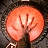 A 48x48 pixel buddy icon split into two frames showing a glowing orange circular object with hand-like shapes on the left and green text 'OriginalIcons.com' on a dark background on the right.