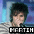 Two side-by-side pixelated images of a person with dark hair and light skin, wearing a striped shirt against a blue background.