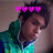 Pixelated image of a person with dark hair wearing a green and blue gradient hoodie, four pink heart symbols above the head, and a blurred background.