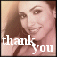 Static pixelated image of a smiling person with long brown hair, overlaid with white text reading 'thank you' in lowercase letters.