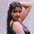 Static 50x50 pixel buddy icon showing a person with long dark hair in a side profile pose, wearing a sleeveless top with green and white sections against a light gray background.