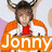 A pixelated image shows a person with brown hair wearing an orange jacket over white clothing and red shirt, holding up two hands near the head against a light background.