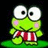 Green frog character with large white eyes and pink cheeks stands on green base, wearing red and white striped shorts against black background with red text
