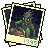 Pixel art of a green monster with red eyes and brown accents, standing in a graveyard with crosses, framed by a decorative border with '1995' text.