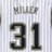 Static pixelated image showing large dark numerals '31' on a light striped background with faint blurred text above.