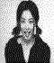 Black-and-white pixelated image of a person in multiple poses showing facial expressions and hand movements against a dotted background.