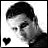 Black-and-white pixelated icon showing a person's profile with short hair, a heart symbol in the bottom-left corner, and high-contrast grayscale rendering on a white background.