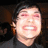 A pixelated image of a person with dark hair and a black shirt, alongside text reading "i love frank and his smile!" on a white background.