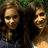 Two people with long curly hair stand side-by-side against a green background, next to bright pink text reading 'bestfriends' in pixelated font.