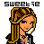 Pixel art icon of a character with long blonde hair, green eyes, and purple eye highlights, wearing a black jacket over a white shirt with a star symbol on the chest.