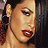 A 4-frame animated contact sheet showing a woman with dark hair, red lipstick, and hoop earrings in various poses with text overlays reading "Aaliyah" and "I CARE 4 U".