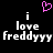 Pixelated text reads 'i love freddyyy' with a pink heart symbol above, displayed on black background.
