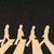 Animated sequence of light-skinned hands forming a circle against black background, with 'Love' text appearing in lower-left frame.