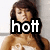 Pixelated image of a person with brown hair wearing a white top, overlaid with bold white text reading 'hott' on a black background.