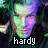 Pixelated image of a person's face with green and purple color grading, surrounded by dark abstract shapes, featuring the text 'hardy' at the bottom.