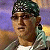 A split-frame contact sheet showing a pixelated image of a person with sunglasses and bandana on the left, and green text reading "Original Icons .com" on a dark green background on the right.