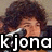 Pixelated image of a person with dark curly hair holding a microphone, overlaid with bold white text reading 'kjona' on black background.