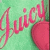 Pixelated image with pink text 'Juicy' on a green background, featuring a large pink circular shape resembling a cherry.