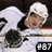 A hockey player in a white uniform with black accents and a white helmet appears in a of four , with the bottom-right blank