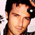 Static pixelated close-up of a person's face with dark hair and light skin, cropped to show forehead through chin against a white background.
